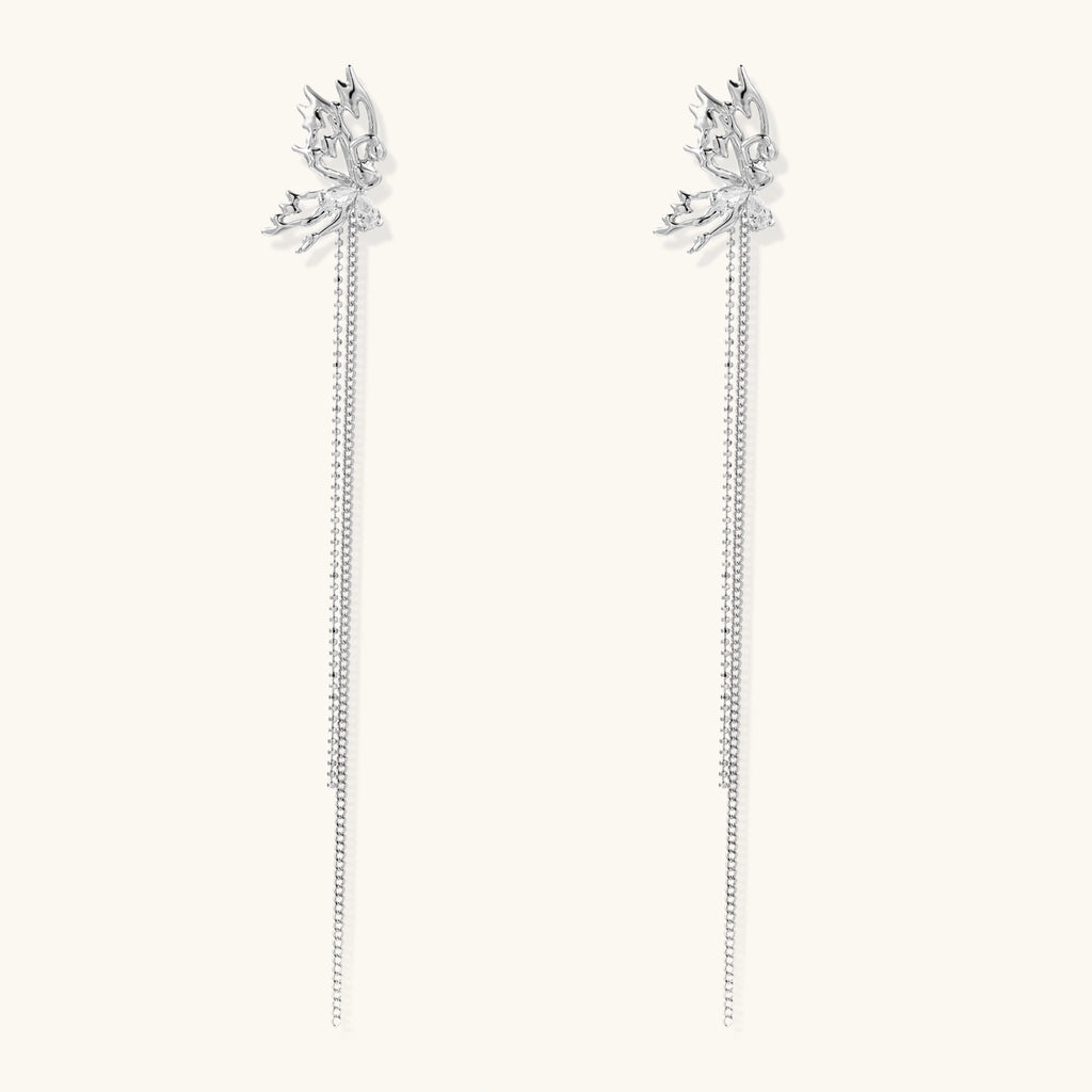 Silver-toned threader earrings featuring detailed fairy figure with wings and dual delicate chain strands, zirconia accents