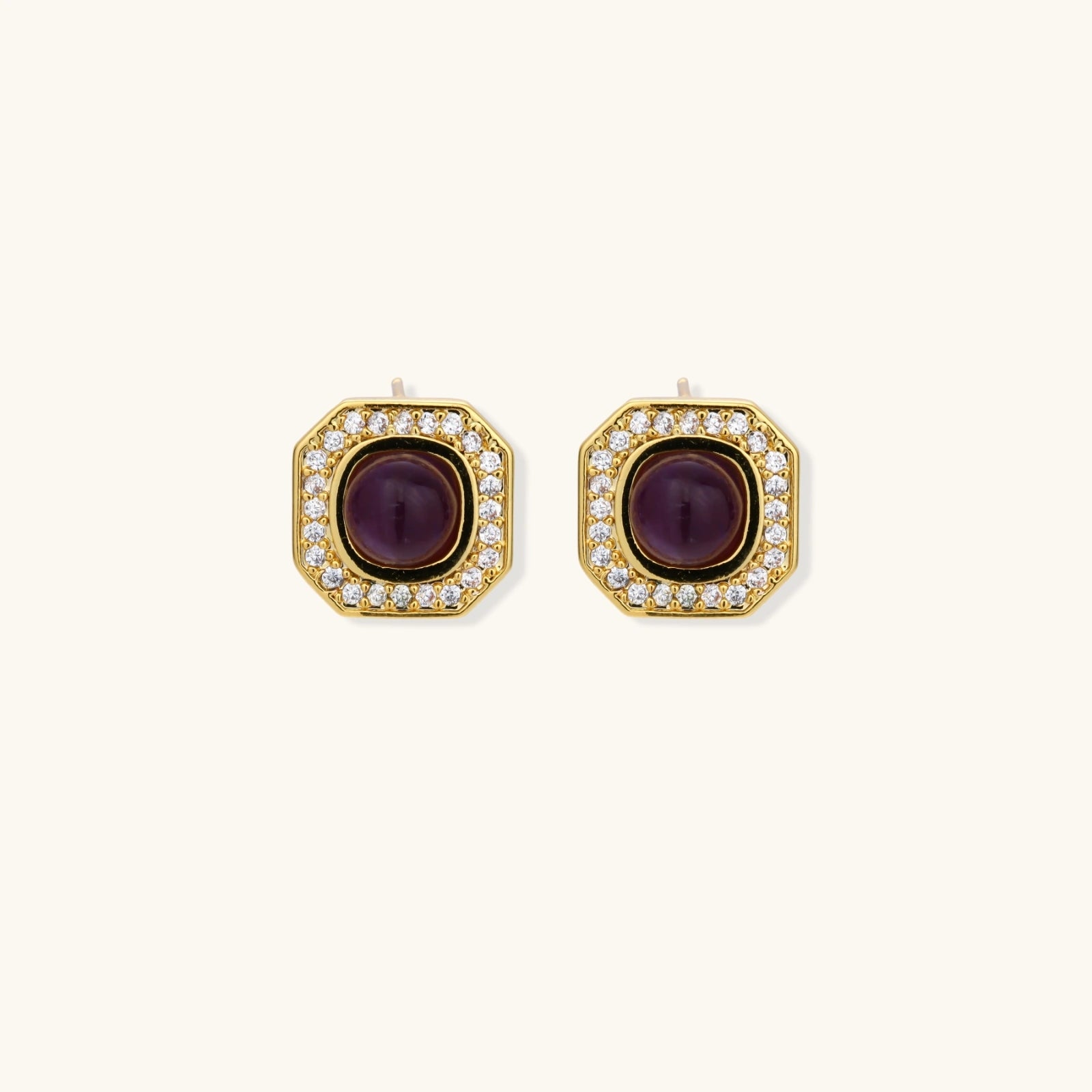 Gold-plated octagonal stud earrings with burgundy liuli centers and cubic zirconia halos on white background